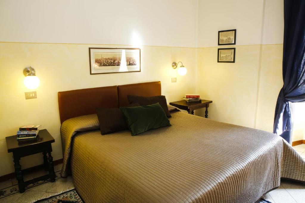 Un ou plusieurs lits dans un hébergement de l'établissement Albergo Garisenda