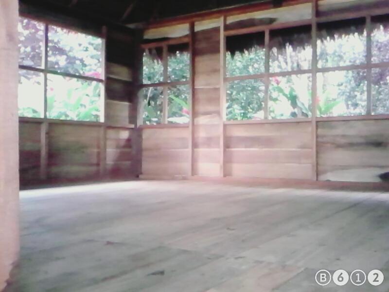 an empty room with large windows in a building at Tambopata River in Puerto Maldonado