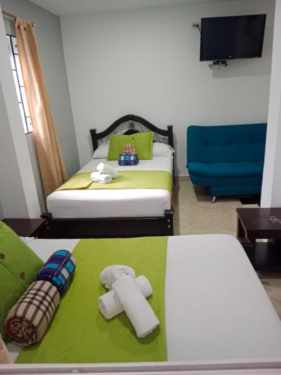 Postel nebo postele na pokoji v ubytování Hotel El Deportista