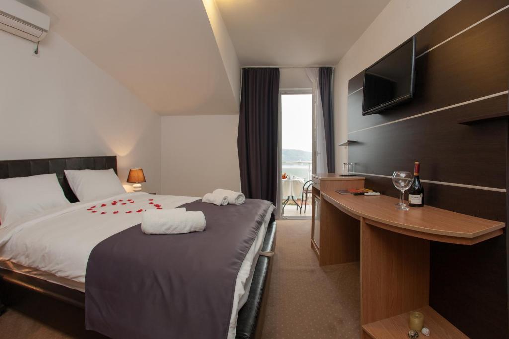 Postel nebo postele na pokoji v ubytování Guest House Aria