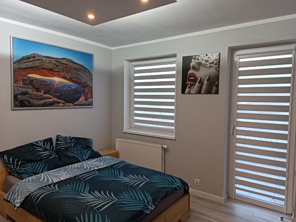 Postel nebo postele na pokoji v ubytování WRN APARTAMENTY