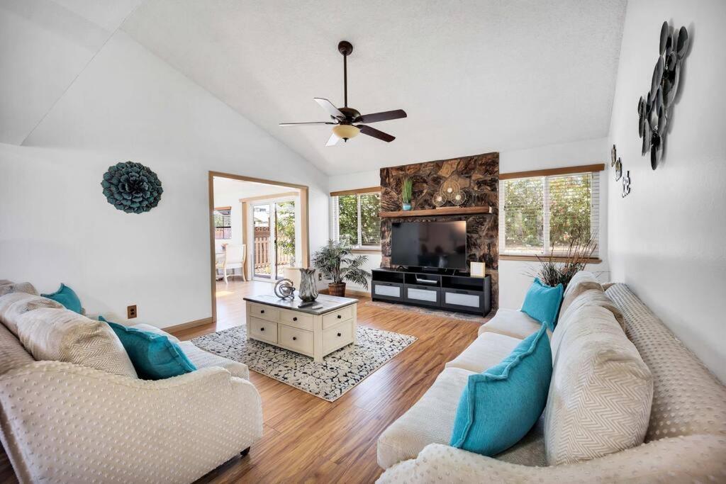 a living room with a couch and a tv at Centrally located Spacious Vacation Hom 13 m strip in Las Vegas