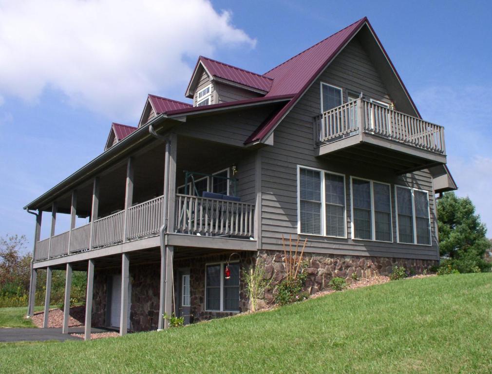 a large house on top of a hill at The Place on the Blue Ridge Parkway in Ore Knob