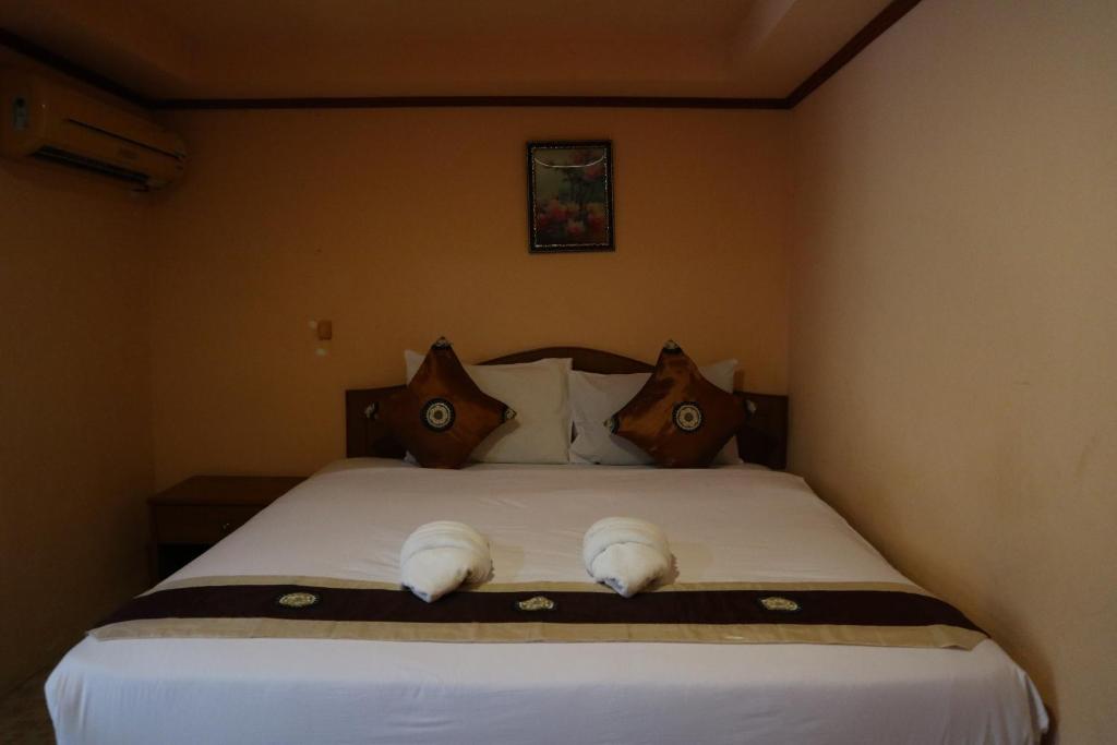 Postel nebo postele na pokoji v ubytování Island View Bungalows