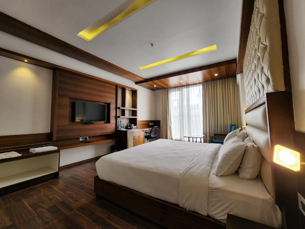 Postel nebo postele na pokoji v ubytování Hotel Preethi International