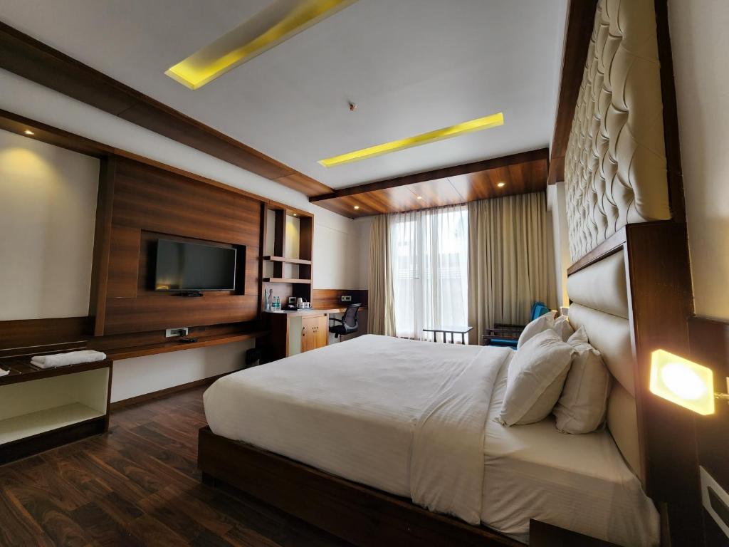 Postel nebo postele na pokoji v ubytování Hotel Preethi International