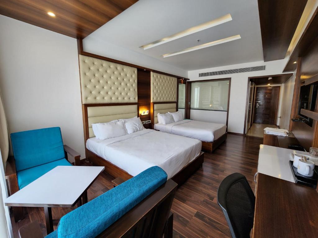 Postel nebo postele na pokoji v ubytování Hotel Preethi International
