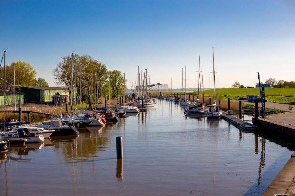 a group of boats are docked in a canal at Bi uns im Norden in Brunsbüttel