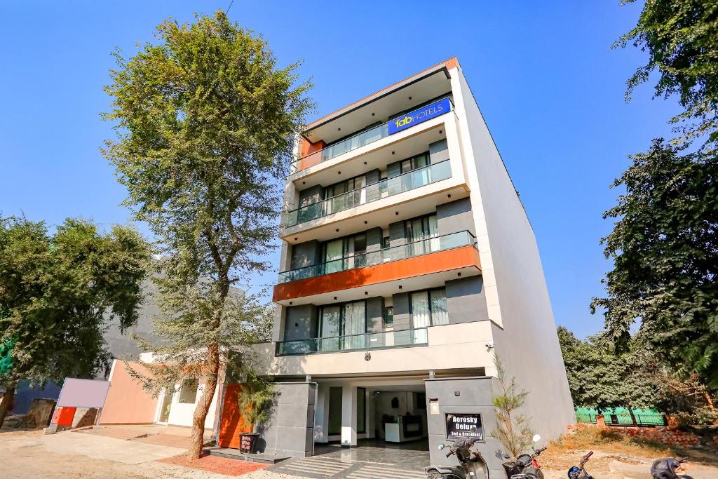 a building with motorcycles parked in front of it at FabExpress Aerosky Deluxe in New Delhi