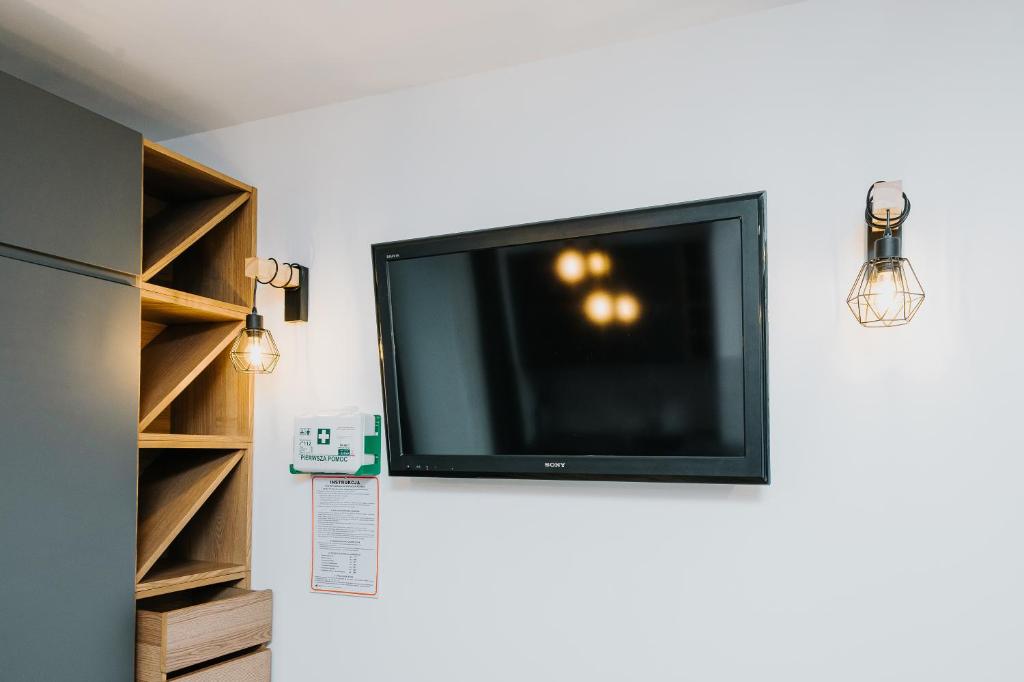 TV a/nebo společenská místnost v ubytování Obiekt Noclegowy OCELOT II