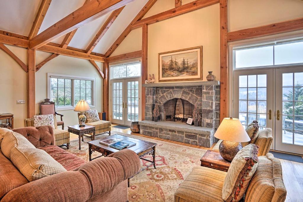a living room filled with furniture and a fireplace at Luxury Vacation Rental in the Berkshires! in Williamstown