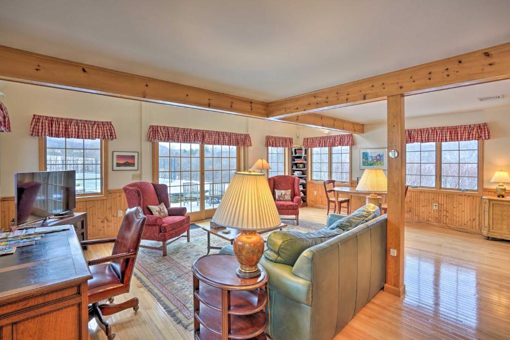 a living room with a couch and a tv at Vacation Rental Home in the Berkshires! in Williamstown