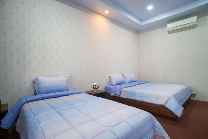 Postel nebo postele na pokoji v ubytování Samui platinum hotel