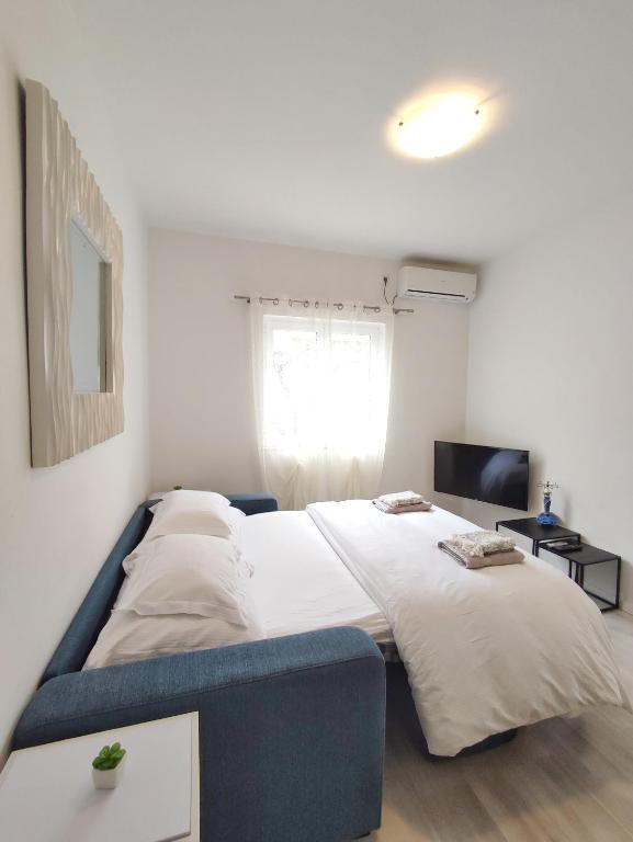 Postel nebo postele na pokoji v ubytování Apartments D&A