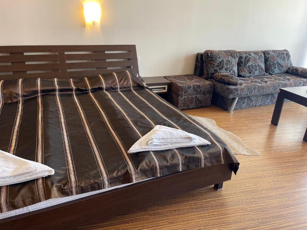 A bed or beds in a room at At the American's Hotel