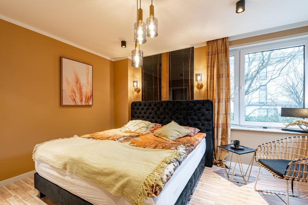 a bedroom with a bed and a window at Fewo Elegance in Binz