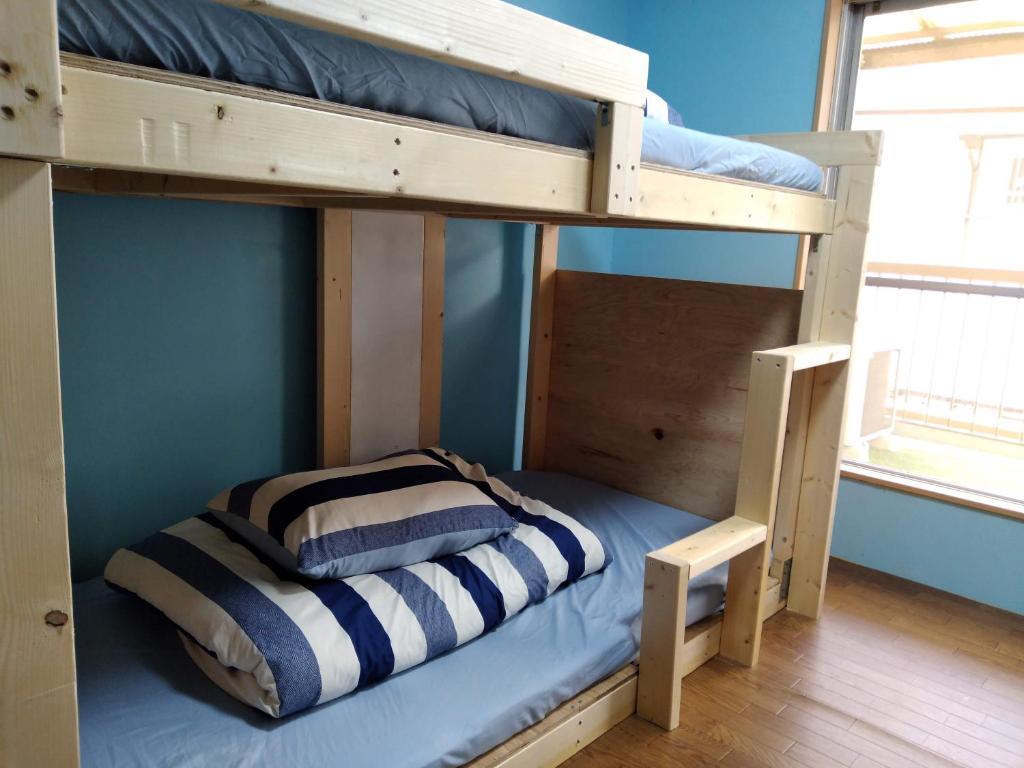 Postel nebo postele na pokoji v ubytování TONARINO Hostel for Backpackers