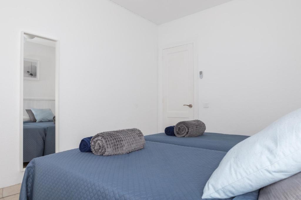 Postel nebo postele na pokoji v ubytování Naia House Lanzarote