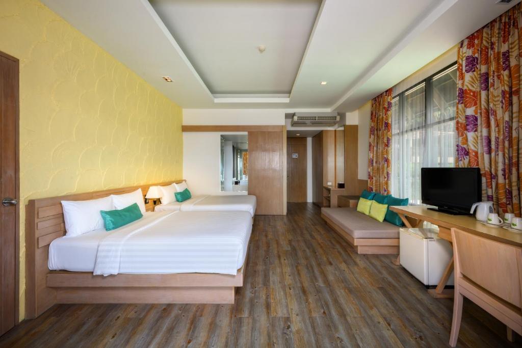Postel nebo postele na pokoji v ubytování Karon Phunaka Resort