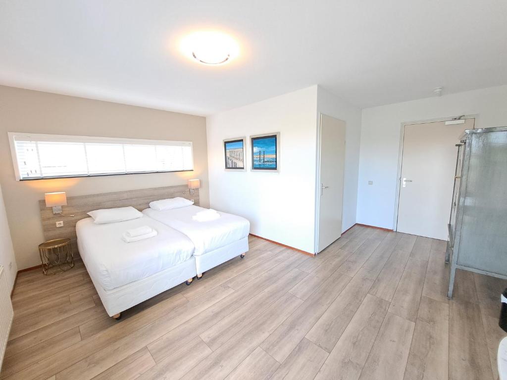 Postel nebo postele na pokoji v ubytování Seehotel Oostkapelle