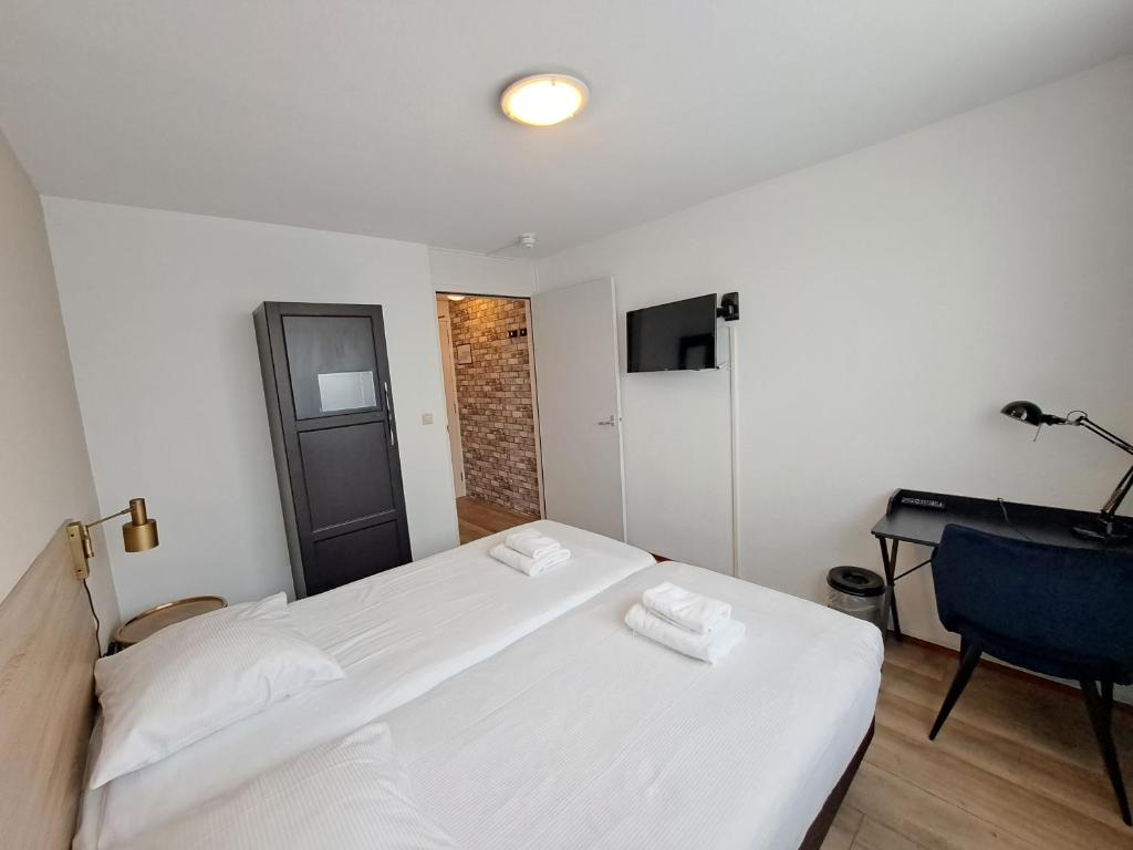 Postel nebo postele na pokoji v ubytování Seehotel Oostkapelle