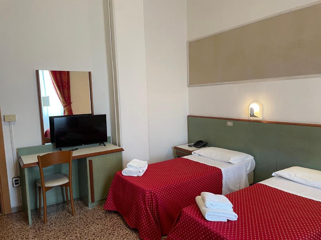 Postel nebo postele na pokoji v ubytování Hotel Lukas