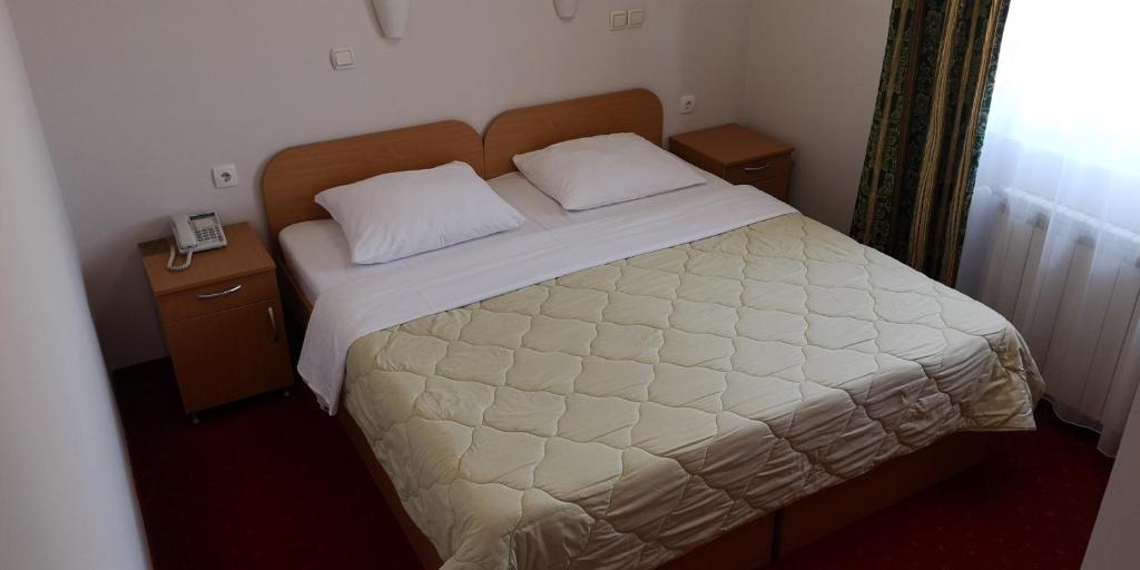 Postel nebo postele na pokoji v ubytování Hotel Elegance
