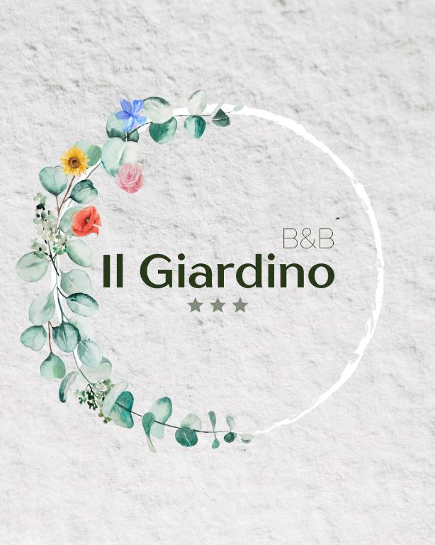 a circle frame with flowers and the words il gabino at B & B Il Giardino in Noto