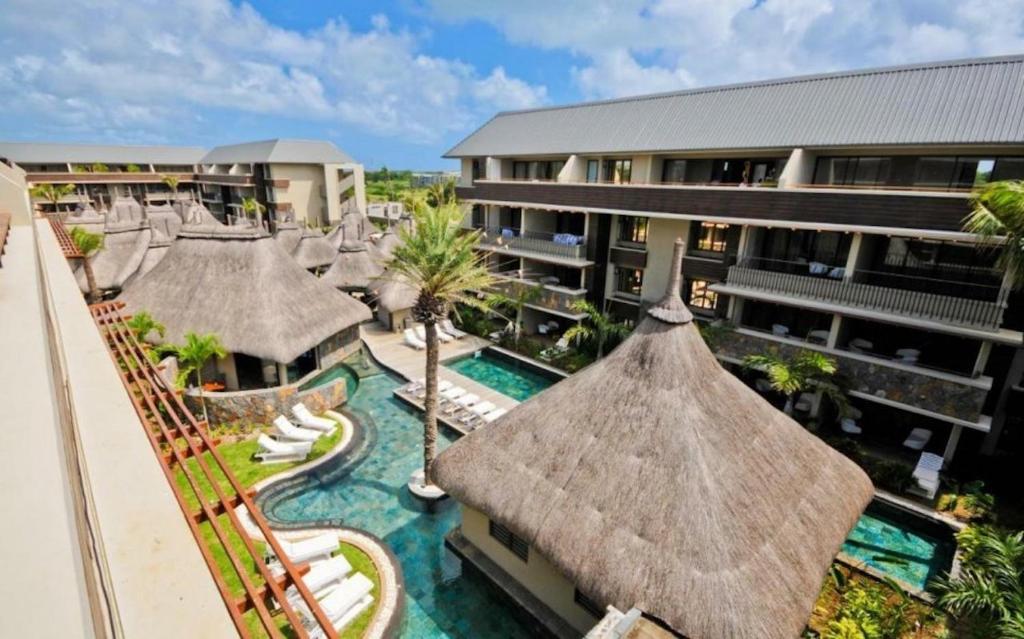 an aerial view of a resort with a swimming pool at SLEEP IN MAURITIUS in Grand Baie