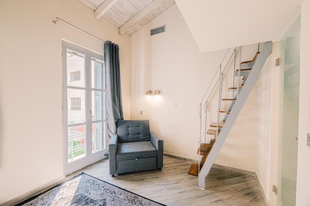 Posezení v ubytování Neapolis 1897 Boutique Luxury Rooms