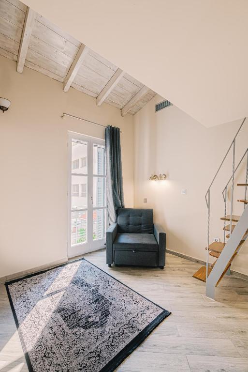 Posezení v ubytování Neapolis 1897 Boutique Luxury Rooms