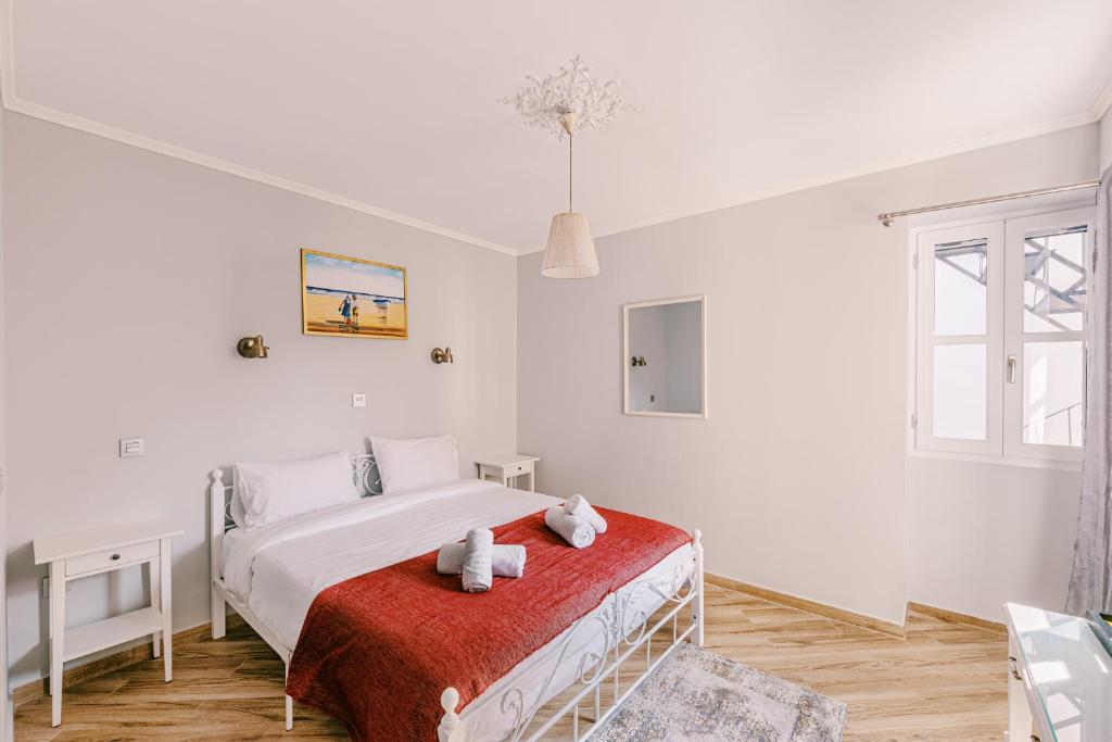 Postel nebo postele na pokoji v ubytování Neapolis 1897 Boutique Luxury Rooms