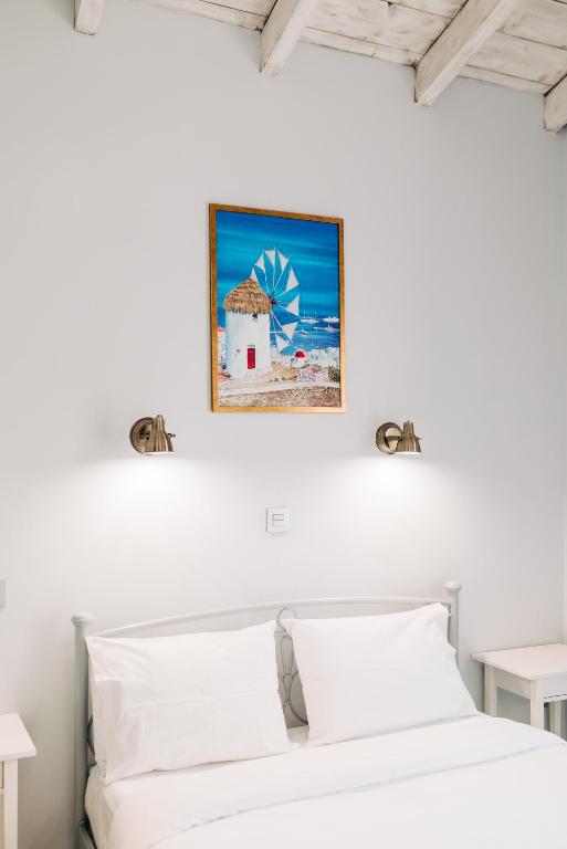 Postel nebo postele na pokoji v ubytování Neapolis 1897 Boutique Luxury Rooms