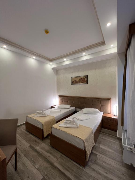 Postel nebo postele na pokoji v ubytování EKA Residence