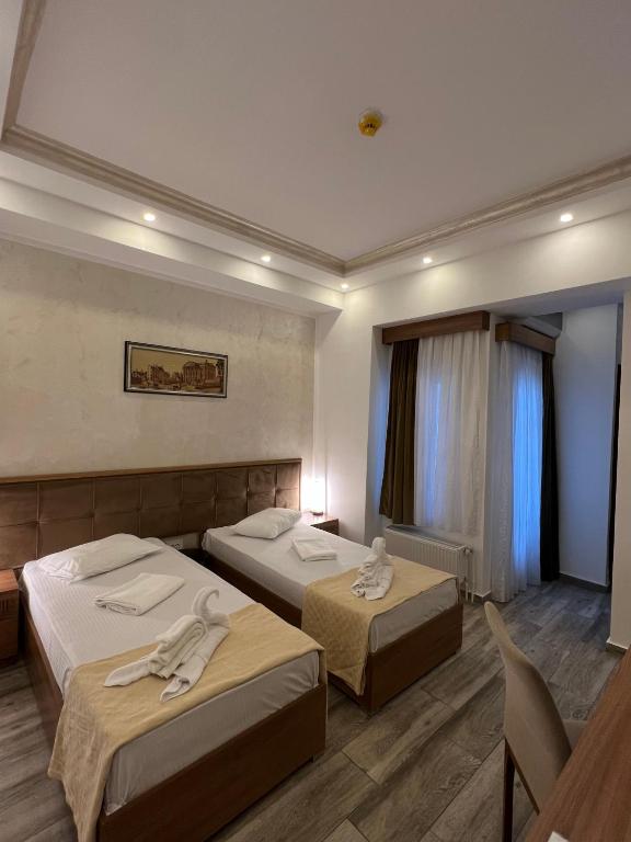 Postel nebo postele na pokoji v ubytování EKA Residence