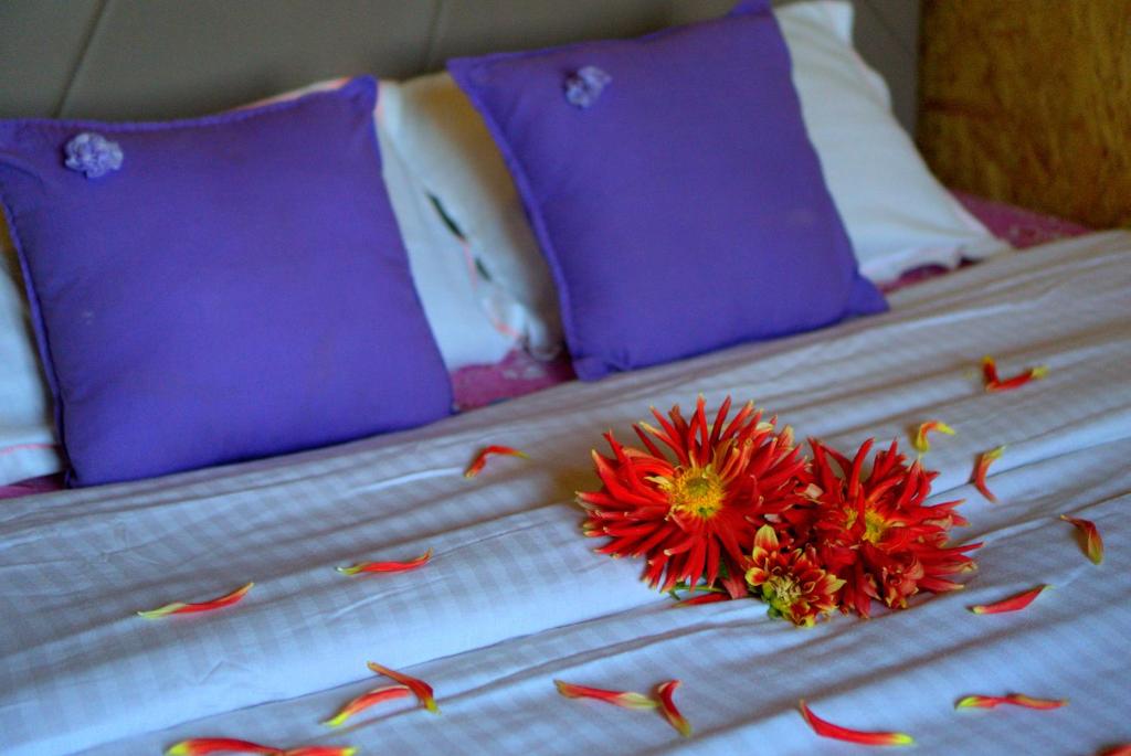 Postel nebo postele na pokoji v ubytování Hie Moksha Glamping