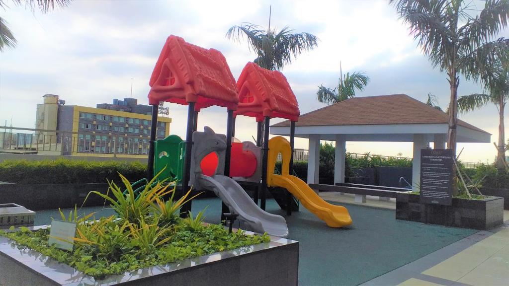 a playground at a resort with a slide at SMDC COAST RESIDENCES in Manila