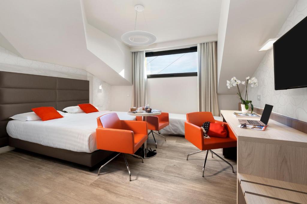 Postel nebo postele na pokoji v ubytování Bhotel