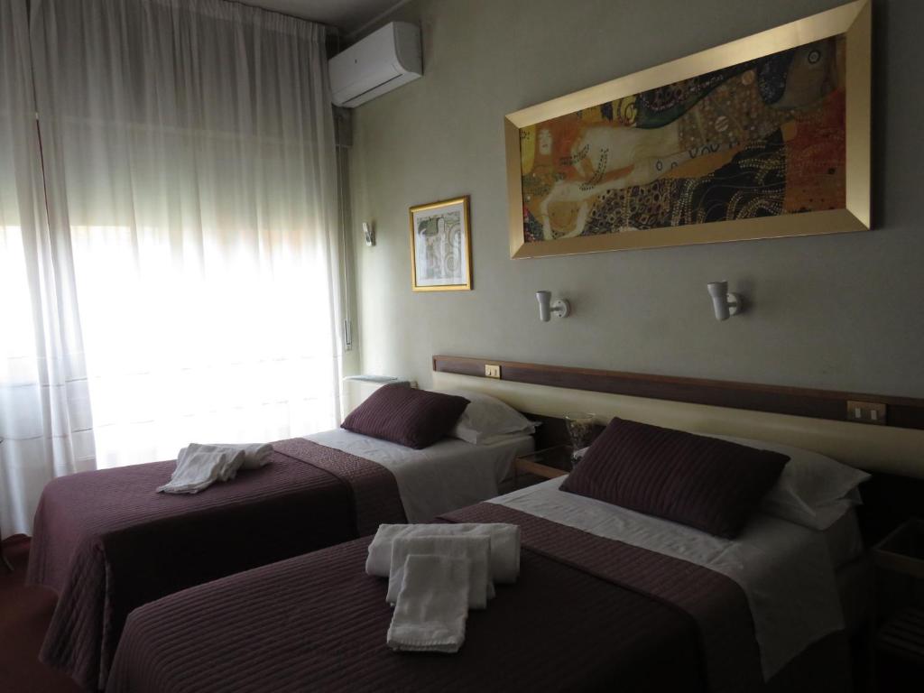 Postel nebo postele na pokoji v ubytování Hotel San Michele