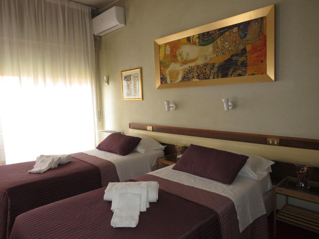 Postel nebo postele na pokoji v ubytování Hotel San Michele