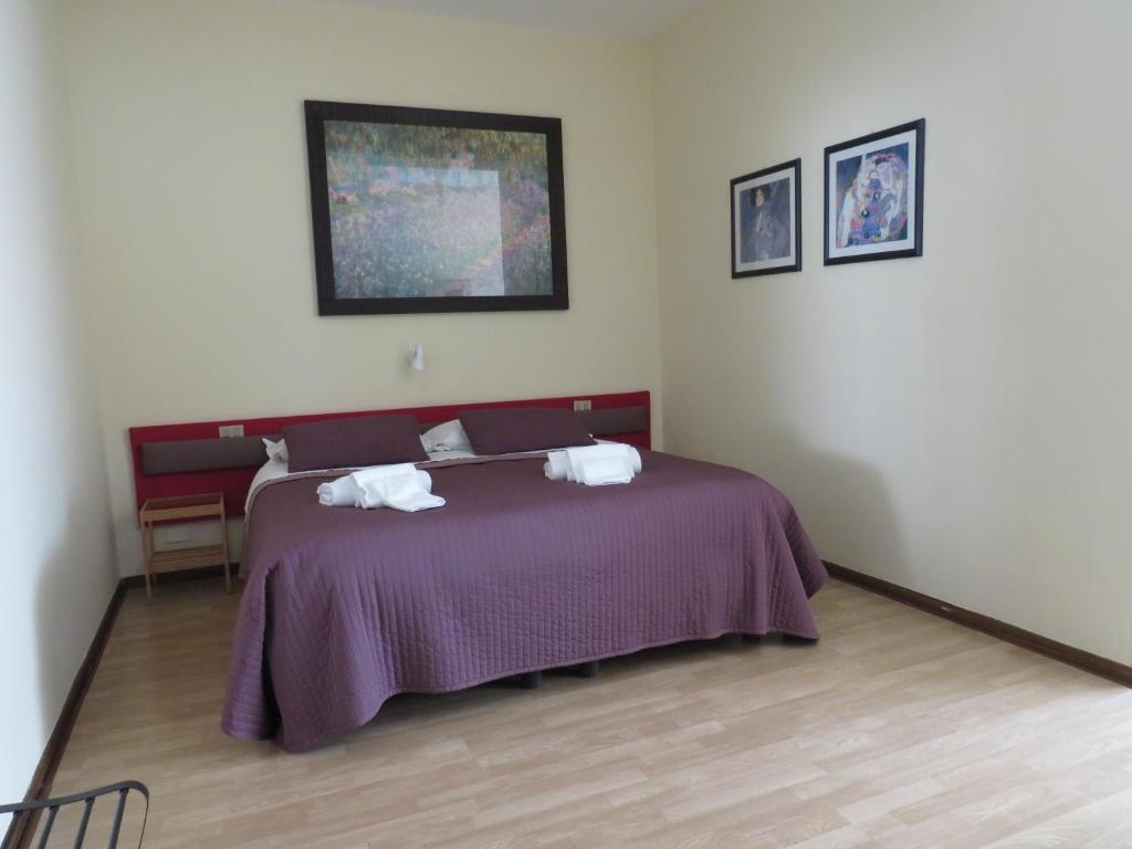 Postel nebo postele na pokoji v ubytování Hotel San Michele