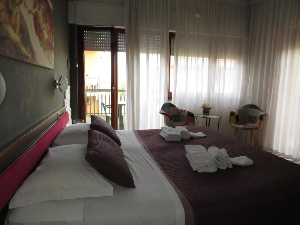Postel nebo postele na pokoji v ubytování Hotel San Michele