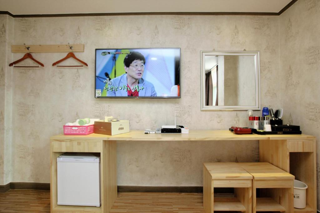 TV a/nebo společenská místnost v ubytování Traum Hotel & Condo