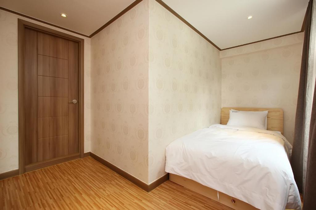 Postel nebo postele na pokoji v ubytování Traum Hotel & Condo