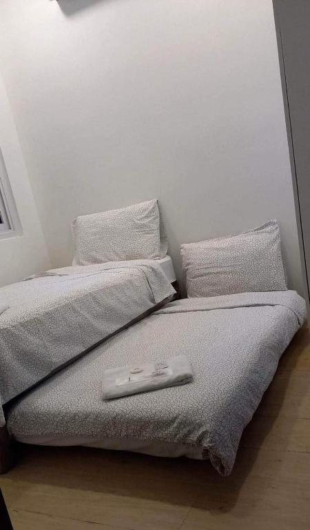 Postel nebo postele na pokoji v ubytování GLC SUITES