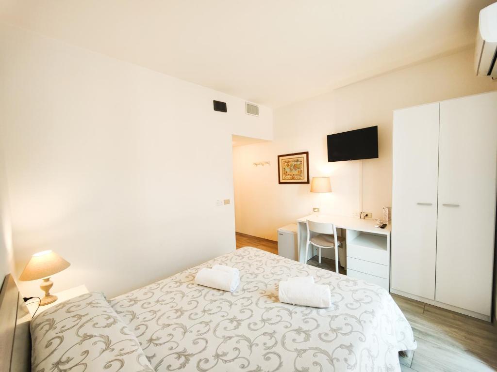 Postel nebo postele na pokoji v ubytování Albergo B&B Tenesi