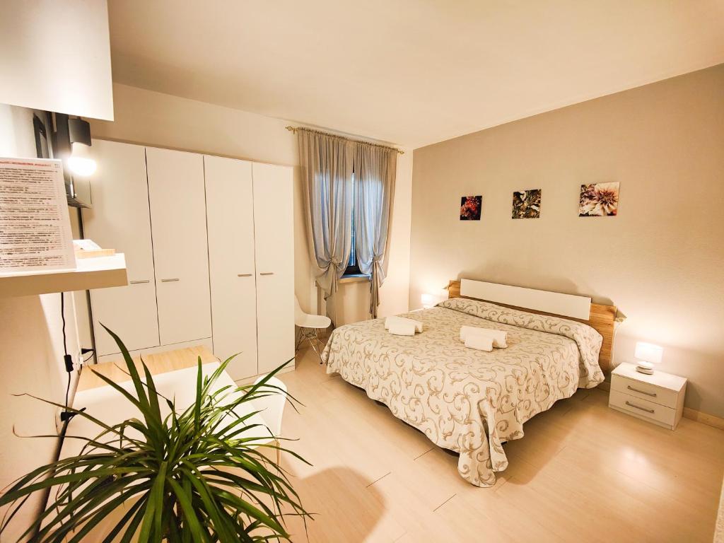 Postel nebo postele na pokoji v ubytování Albergo B&B Tenesi