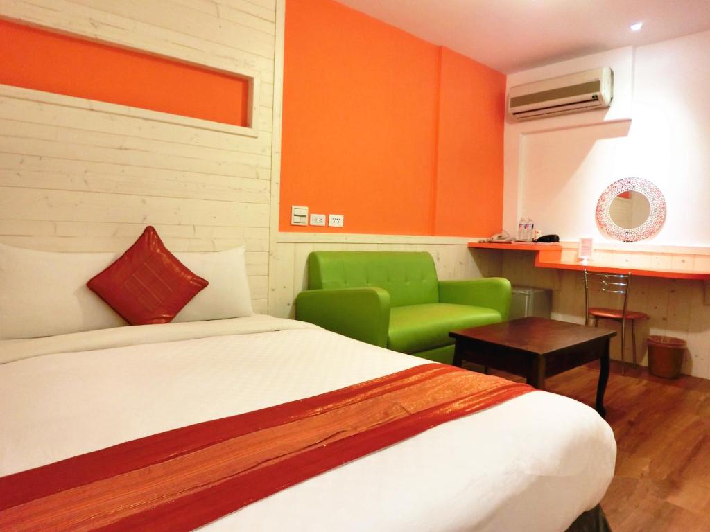 Postel nebo postele na pokoji v ubytování Xing Ji Hotel