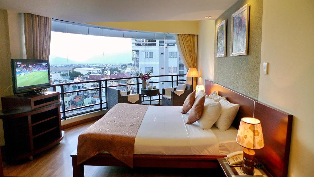 TV a/nebo společenská místnost v ubytování Asia Paradise Hotel