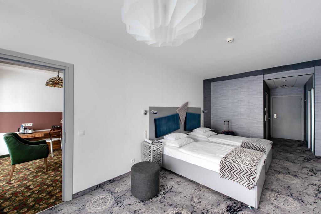 Posteľ alebo postele v izbe v ubytovaní Hotel Lenart
